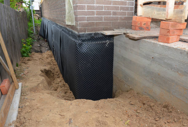 SJ Waterproofing Pros technician performing targeted Wet Basement Repair assessment in Oregonia, OH